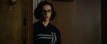 Movie still from “Hitchcock” (2012), directed by Sacha Gervasi – A woman with glasses looking at a mirror; Medium shot, Over the shoulder angle