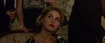 Movie still from “Hitchcock” (2012), directed by Sacha Gervasi – A woman with red lipstick looking up into the sky; Close Up shot, Over the shoulder angle