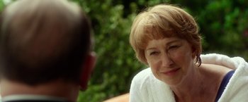 Movie still from “Hitchcock” (2012), directed by Sacha Gervasi – An older woman sitting in front of another person; Close Up shot, Over the shoulder angle