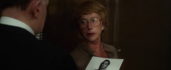 Movie still from “Hitchcock” (2012), directed by Sacha Gervasi – A woman holding up a picture of a woman; Close Up shot, Over the shoulder angle