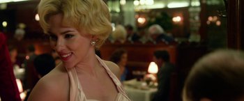 Movie still from “Hitchcock” (2012), directed by Sacha Gervasi – A woman with blonde hair wearing a white dress; Close Up shot, Over the shoulder angle