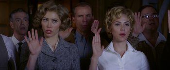 Movie still from “Hitchcock” (2012), directed by Sacha Gervasi – A man and two women standing next to each other; Close Up shot, Low angle