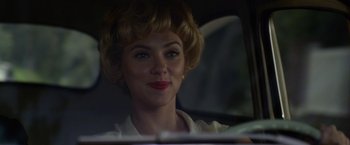 Movie still from “Hitchcock” (2012), directed by Sacha Gervasi – A woman sitting in the back seat of a car; Close Up shot, Over the shoulder angle