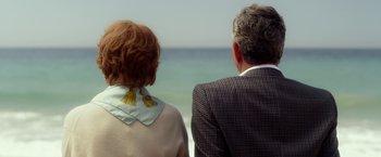 Movie still from “Hitchcock” (2012), directed by Sacha Gervasi – A man and a woman looking out at the ocean; Medium shot, Over the shoulder angle