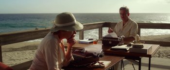 Movie still from “Hitchcock” (2012), directed by Sacha Gervasi – Two women sitting at a table with a typewriter; Medium shot, High angle