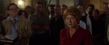 Movie still from “Hitchcock” (2012), directed by Sacha Gervasi – A group of men and women standing in a room; Close Up shot, Over the shoulder angle