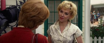 Movie still from “Hitchcock” (2012), directed by Sacha Gervasi – Two women talking to each other in front of a building; Close Up shot, Over the shoulder angle