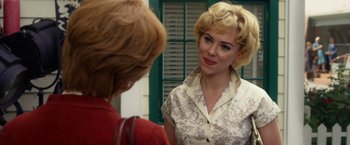 Movie still from “Hitchcock” (2012), directed by Sacha Gervasi – Two women talking to each other in front of a building; Close Up shot, Over the shoulder angle