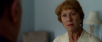 Movie still from “Hitchcock” (2012), directed by Sacha Gervasi – An older woman with short brown hair and blue eyes; Close Up shot, Over the shoulder angle