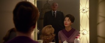 Movie still from “Hitchcock” (2012), directed by Sacha Gervasi – A man and a woman looking in a mirror; Medium shot, Over the shoulder angle