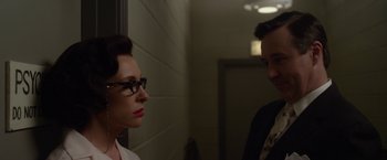 Movie still from “Hitchcock” (2012), directed by Sacha Gervasi – A woman and a man standing next to each other in a hallway; Close Up shot, Over the shoulder angle