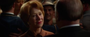 Movie still from “Hitchcock” (2012), directed by Sacha Gervasi – An older woman is smiling at a man; Close Up shot, Over the shoulder angle