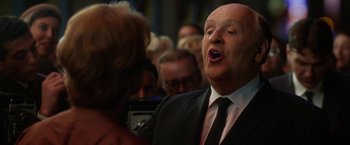 Movie still from “Hitchcock” (2012), directed by Sacha Gervasi – An older man wearing a suit and a tie; Close Up shot, Low angle