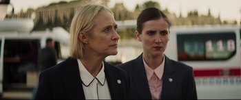 Movie still from “Hitman's Wife's Bodyguard” (2021), directed by Patrick Hughes – Two women are standing next to each other; Close Up shot, Low angle