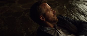 Movie still from “Hitman's Wife's Bodyguard” (2021), directed by Patrick Hughes – A person wearing a shirt; Close Up shot, Overhead angle