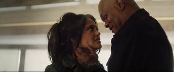 Movie still from “Hitman's Wife's Bodyguard” (2021), directed by Patrick Hughes – A man and a woman are looking into each others eyes; Close Up shot, Low angle