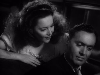 Movie still from “Hold Back the Dawn” (1941), directed by Mitchell Leisen – An old photo of a man and a woman; Close Up shot, Low angle