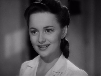 Movie still from “Hold Back the Dawn” (1941), directed by Mitchell Leisen – An old black and white photo of a woman; Close Up shot, High angle