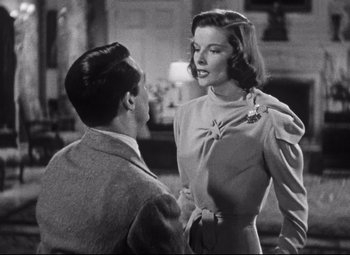 Movie still from “Holiday” (1938), directed by George Cukor – A man and a woman talking to each other; Medium shot, Low angle