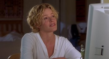 Movie still from “Hollow Man” (2000), directed by Paul Verhoeven – A person sitting at a table in a room; Close Up shot, Over the shoulder angle