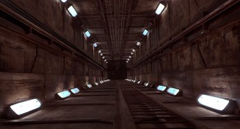 Movie still from “Hollow Man” (2000), directed by Paul Verhoeven – A train tunnel with lights on the side of the track; Extreme Wide shot, Overhead angle
