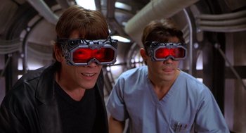 Movie still from “Hollow Man” (2000), directed by Paul Verhoeven – A couple of people that are wearing goggles; Close Up shot, Low angle