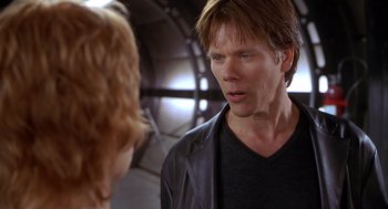 Movie still from “Hollow Man” (2000), directed by Paul Verhoeven – A man and a woman are talking in a room; Close Up shot, Over the shoulder angle