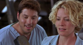 Movie still from “Hollow Man” (2000), directed by Paul Verhoeven – A man and a woman looking at one another; Close Up shot, Low angle