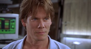 Movie still from “Hollow Man” (2000), directed by Paul Verhoeven – A person wearing a white shirt; Close Up shot, Low angle