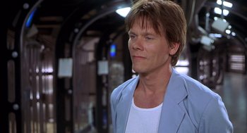 Movie still from “Hollow Man” (2000), directed by Paul Verhoeven – A person wearing a jacket; Close Up shot, Over the shoulder angle