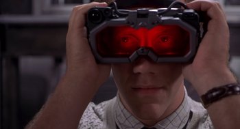 Movie still from “Hollow Man” (2000), directed by Paul Verhoeven – A man wearing a pair of goggles with red lights; Close Up shot, Over the shoulder angle