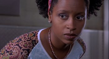 Movie still from “Hollow Man” (2000), directed by Paul Verhoeven – A person wearing a necklace; Close Up shot, High angle