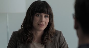 Movie still from “Holy Lands” (2017), directed by Amanda Sthers – A person wearing a jacket; Close Up shot, Over the shoulder angle