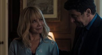 Movie still from “Holy Lands” (2017), directed by Amanda Sthers – A man and a woman are smiling at each other; Close Up shot, Over the shoulder angle