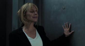 Movie still from “Holy Lands” (2017), directed by Amanda Sthers – A woman in a black jacket and white shirt; Close Up shot, Low angle