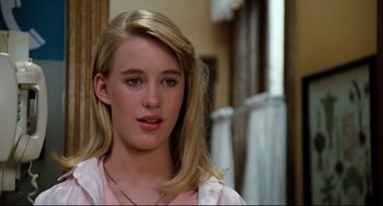 Movie still from “Honey, I Shrunk the Kids” (1989), directed by Joe Johnston – A woman with blonde hair and a pink shirt; Close Up shot, Over the shoulder angle