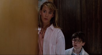 Movie still from “Honey, I Shrunk the Kids” (1989), directed by Joe Johnston – A young woman standing next to a young boy; Medium shot, Over the shoulder angle