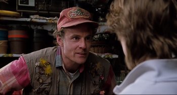 Movie still from “Honey, I Shrunk the Kids” (1989), directed by Joe Johnston – A man wearing a hat talking to another man; Close Up shot, Over the shoulder angle