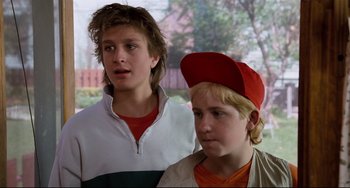 Movie still from “Honey, I Shrunk the Kids” (1989), directed by Joe Johnston – Two young boys standing next to each other; Close Up shot, Low angle