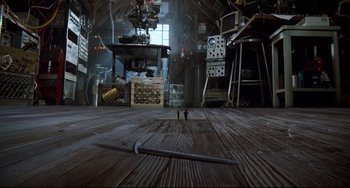 Movie still from “Honey, I Shrunk the Kids” (1989), directed by Joe Johnston – A room filled with lots and lots of tools; Wide shot, Overhead angle