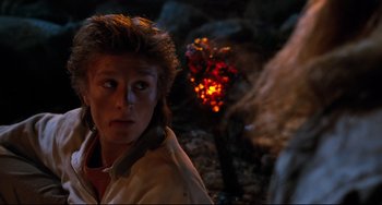 Movie still from “Honey, I Shrunk the Kids” (1989), directed by Joe Johnston – A young man in a jacket is looking at the camera; Close Up shot, Over the shoulder angle