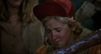 Movie still from “Honey, I Shrunk the Kids” (1989), directed by Joe Johnston – A young boy wearing a baseball cap is crying; Close Up shot, Over the shoulder angle