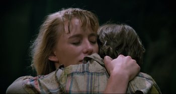Movie still from “Honey, I Shrunk the Kids” (1989), directed by Joe Johnston – A woman is hugging another woman and kissing her cheek; Close Up shot, Over the shoulder angle