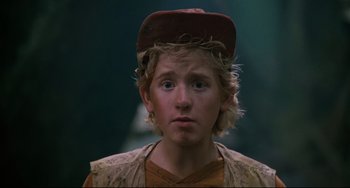 Movie still from “Honey, I Shrunk the Kids” (1989), directed by Joe Johnston – A young boy wearing a hat and looking at the camera; Close Up shot, Low angle