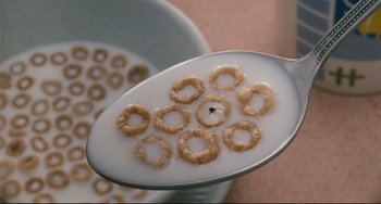 Movie still from “Honey, I Shrunk the Kids” (1989), directed by Joe Johnston – A spoonful of cereal on top of a spoon; Extreme Close Up shot, Overhead angle