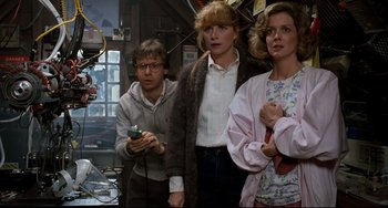 Movie still from “Honey, I Shrunk the Kids” (1989), directed by Joe Johnston – A group of people standing next to each other in a room; Medium shot, Low angle