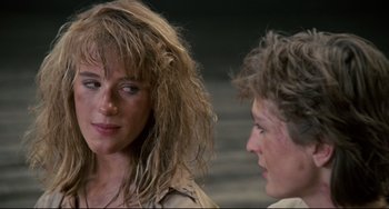 Movie still from “Honey, I Shrunk the Kids” (1989), directed by Joe Johnston – A woman and a man are talking to each other; Close Up shot, Over the shoulder angle