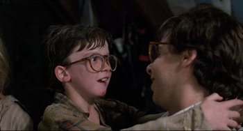 Movie still from “Honey, I Shrunk the Kids” (1989), directed by Joe Johnston – A man and a boy wearing glasses talking to each other; Close Up shot, Over the shoulder angle