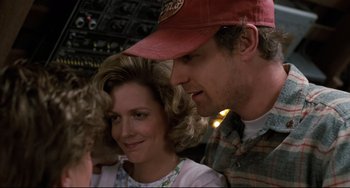 Movie still from “Honey, I Shrunk the Kids” (1989), directed by Joe Johnston – A man and a woman sitting next to each other; Close Up shot, Over the shoulder angle