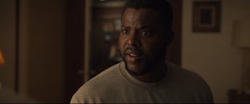 Movie still from “Us” (2019), directed by Jordan Peele – A person with his mouth wide open; Close Up shot, Over the shoulder angle